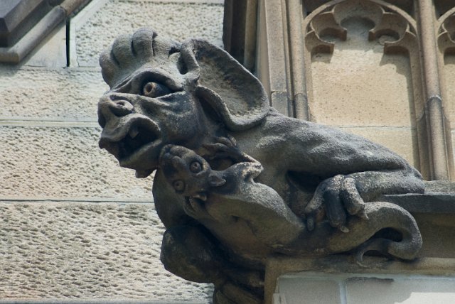 gothic revival grotesque stone decoration chimera creature with baby