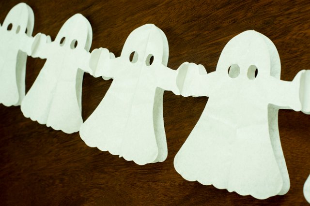 halloween ghost decorations with a green tint