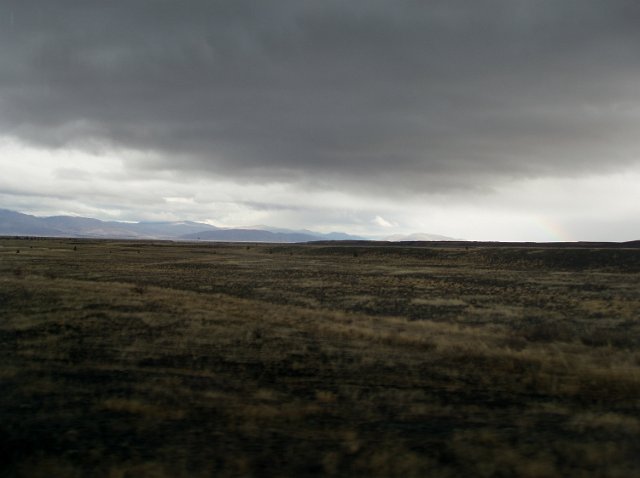 a dark foreboding landscape with low stormy clouds