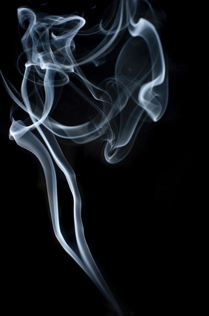 a spooky looking whisp on smoke on a black backdrop