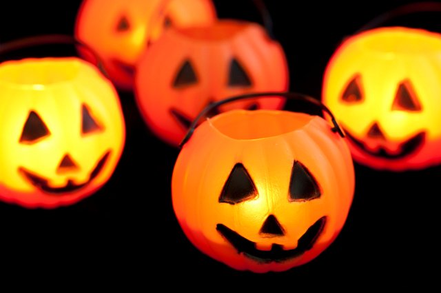 orange candlelight glowing jack-o-lantern decorations