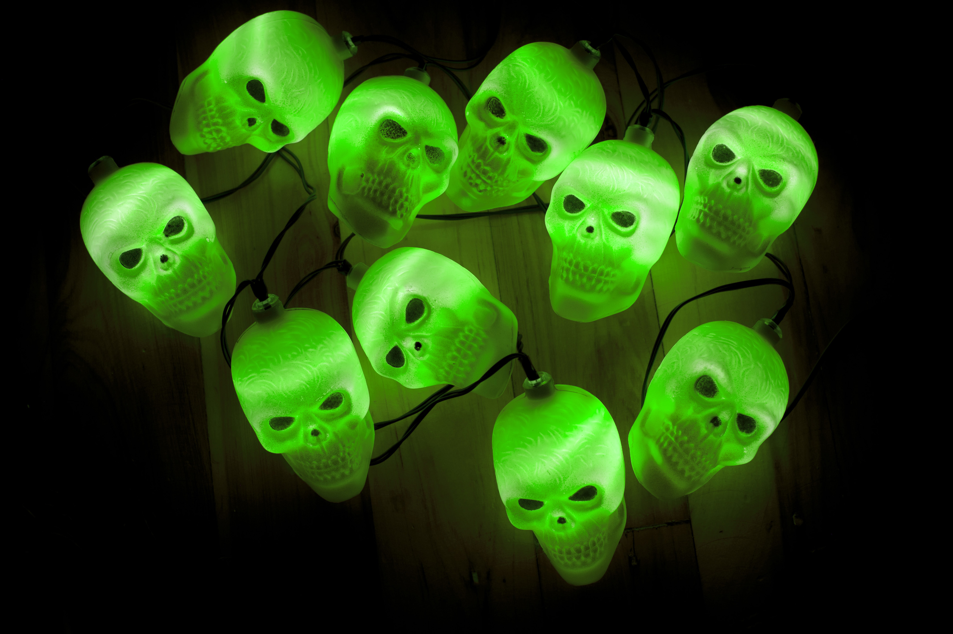 green halloween lights image of cluster of glowing green halloween lights. 