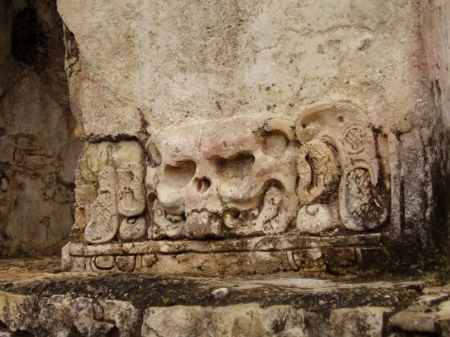 a skull shaped stone carving on a temple wall